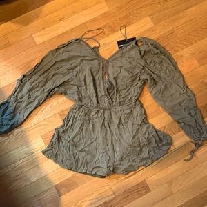 Long sleeve, green romper.